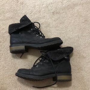 Black flap over boots